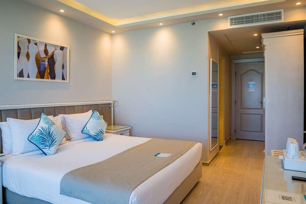 โรงแรมซันไรส์ อเล็กซ์ อเวนิว อเล็กซานเดรีย ห้อง รูปภาพ A room at the hotel