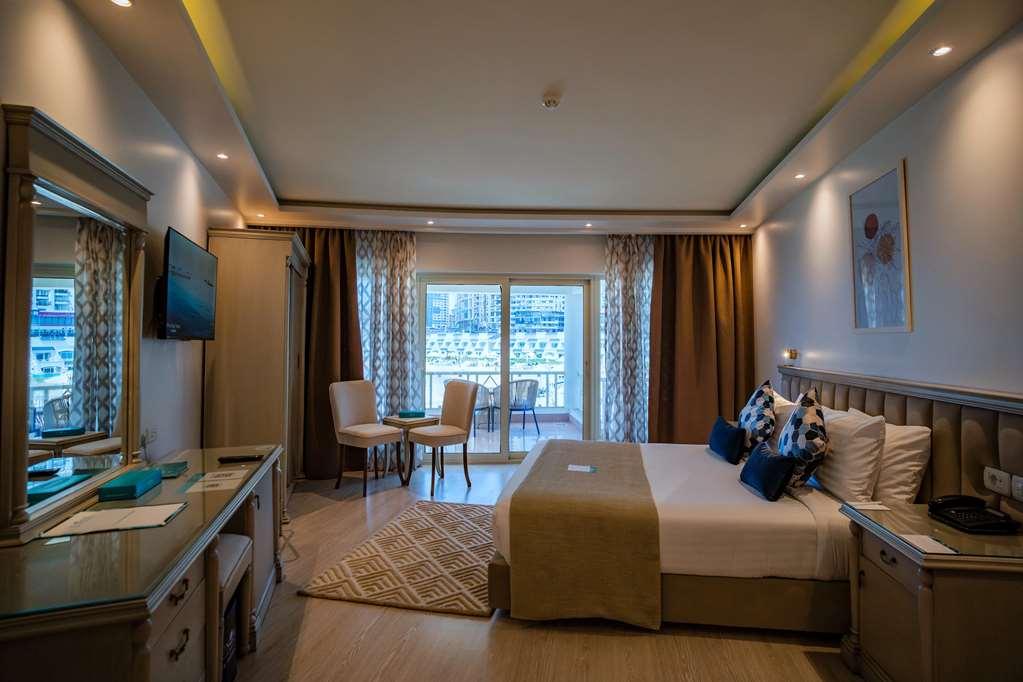 โรงแรมซันไรส์ อเล็กซ์ อเวนิว อเล็กซานเดรีย ห้อง รูปภาพ A room at the hotel